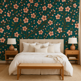 Floral pattern wallpaper with a teal background from Wallshoppe, featuring a peach blossom design.
