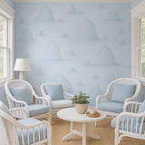 Haystack Rock Wallpaper in light blue, with hand-drawn mountains pattern, featuring a minimalist, coastal style.
