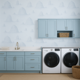 Haystack Rock wallpaper with blue and white island pattern on a light blue background.