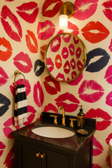 Colorful velvet kiss wallpaper with kiss pattern, reflected in a round mirror.
