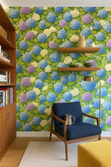 Floral wallpaper with hydrangea design, featuring blue, purple, and white blossoms.
