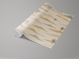 Dune Lines wallpaper with beige, pink, and golden stripes by [Vendor name], with palm tree pattern.