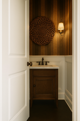 Striped Renaissance Wallpaper with vertical lines, covering a bathroom wall.