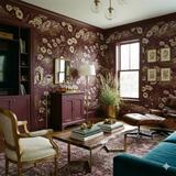 Serrano Vista Tapestry Wallpaper with a floral and mountain landscape pattern on a plum background.