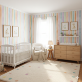 Pastel Promenade Wallpaper with colorful vertical stripes, creating a whimsical aesthetic for a nursery.