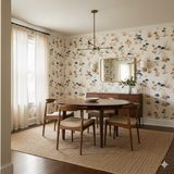 Indigo Mycelia Wallpaper with mushroom pattern and blue accents, covering the walls of a dining room.