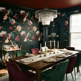 Floral pattern wallpaper with green and pink roses, Rococo Drift Wallpaper, and a black wainscoting.
