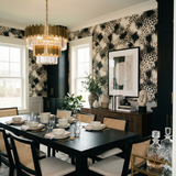 Black and white Smokeveil Savannah wallpaper with animal print by Wallshoppe, displayed in a dining room setting.