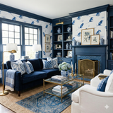 Fieldmouse Garden Wallpaper with blue mouse print, accenting a room with a blue sofa and white armchair.