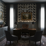 Patterned wallpaper with Scottie dogs from Invergray Terrace, against dark gray paneled walls.