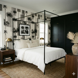 Columnar wallpaper with a black and beige palm tree pattern, decorating a bedroom with a metal four-poster bed.