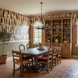Cellar Reverie wallpaper with bottle pattern on the wall in a dining room setting.