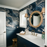 Bathymetric Starshore wallpaper with swirling pattern, star accents, and coastal theme.