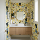 Patterned wallpaper from York Wallcoverings featuring dogs and lemons in a yellow palette.
