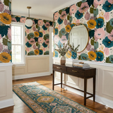 Floral Painter’s Assembly Wallpaper with a cream background, from Wallshoppe, featuring pink, teal and gold blooms in a hallway setting.