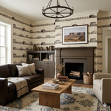 Homestead Ledger wallpaper with a historic rural design, featuring farm structures and fence lines on a neutral textured surface.
