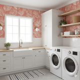 Palm pattern wallpaper with coral background, from RoomMates, visible in laundry room setting.