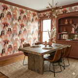 Desert Aurelia Wallpaper featuring women in hats, with patterns and textures on the wall.
