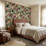 Floral and dog print wallpaper with roses and Cavalier King Charles Spaniels, decorating a bedroom.