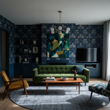 Blue floral patterned wallpaper with dark blue cabinets and dark navy trim, with coordinating green mid-century sofa, under a geometric pendant light.