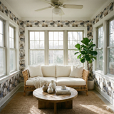 Pebblestone pattern wallpaper by Quarrywell with a neutral color palette in a bright sunroom.