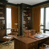 Patterned wallpaper with black script on a gold background, textured finish.