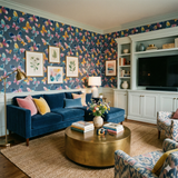 Bellewave Monarchs Wallpaper with a watercolor butterfly pattern against a blue backdrop.