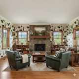 Timberline Hollow Wallpaper with bears and trees pattern, decorating a living room with a stone fireplace.
