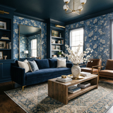Blue floral Arbor Row Wallpaper with a white blossom pattern on an accent wall.