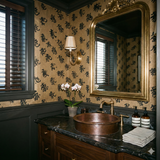 Imperial Script Wallpaper with gold backdrop and black Chinese characters, covering bathroom wall