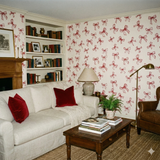 Keepsake Loop wallpaper with red bow pattern on a cream background.