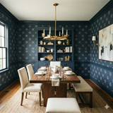 Navy floral patterned wallpaper by Calder Spur, covering a dining room's walls and complementing its warm wood furniture.
