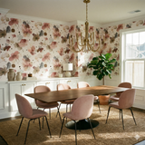 Floral patterned Mira Drift Wallpaper with watercolor texture, covering a dining room wall.