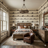 Homestead Ledger wallpaper with barn and fence pattern, covering the walls in a bedroom.
