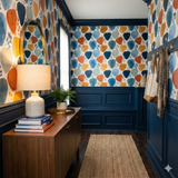 Terra Clay Collage Wallpaper with multicolored abstract shapes over a light background.