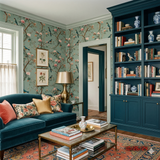 Floral and bird patterned wallpaper in a verdant serenade design featuring branches and blossoms.