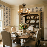 Patterned Wintertail Wallpaper featuring dog motif, covering dining room walls.