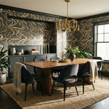 Contemporary wallpaper with flowing gold and white lines on gray, from Goldshore, adding a stylish pattern to the dining room.

