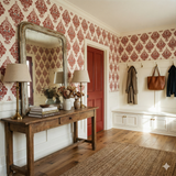 Cinnabar Vignette wallpaper in a floral damask pattern, decorating a stylish entryway.
