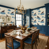 Blue sentinel wallpaper featuring birds and nests on a light background, set in a dining room.
