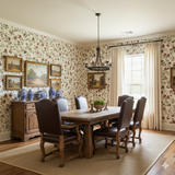 Rosecroft Vine wallpaper featuring a floral pattern on the wall, alongside a wooden dining set.