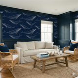 Pelagic Lineage Wallpaper featuring a navy blue whale pattern over a matching background.

