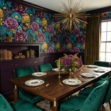 Floral wallpaper by Wallshoppe featuring blooms in jewel tones on a dark background.