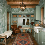 Evergreen Vale wallpaper with a fern pattern, covering the walls in an entryway.
