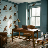 Blackwatch Nest wallpaper, featuring bird illustration, on a light blue backdrop.
