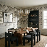 Stonegrain Drift wallpaper with a textured brushstroke pattern in neutral tones, covering a dining room wall.