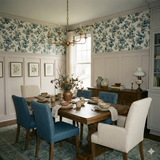 Juniper wallpaper by Bluewake with a botanical pattern in a dining room setting.