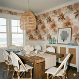 Palmera Sundrift wallpaper featuring a tropical palm tree pattern on a textured surface.