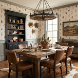 Botanical print wallpaper with red and green florals and cacti, styled in a dining room setting.