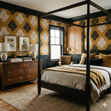 Guildhall Linen Wallpaper featuring a damask leaf pattern, in tones of yellow and black, covering a traditionally styled bedroom.